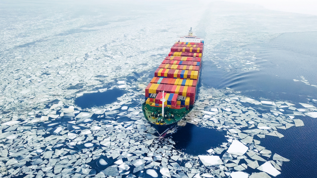 Aerial view of container ship in the sea at winter time