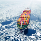 Aerial view of container ship in the sea at winter time