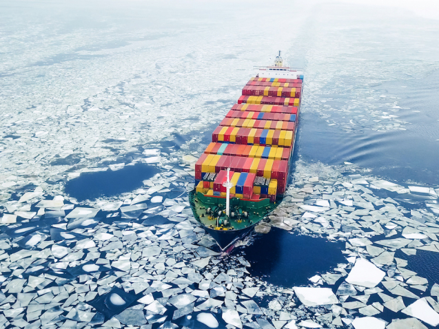 Aerial view of container ship in the sea at winter time